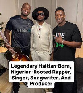 Wyclef Jean with two men (the co-hosts) wearing One54 Africa Podcast shirts